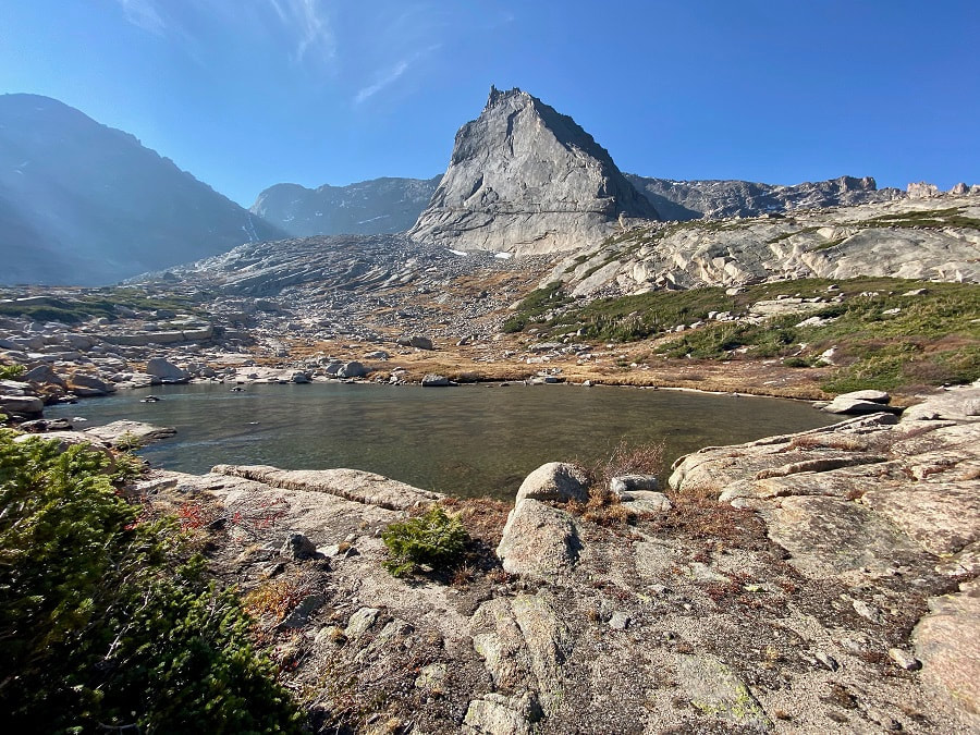 Spearhead Peak over a small tarn, making a dramatic statement