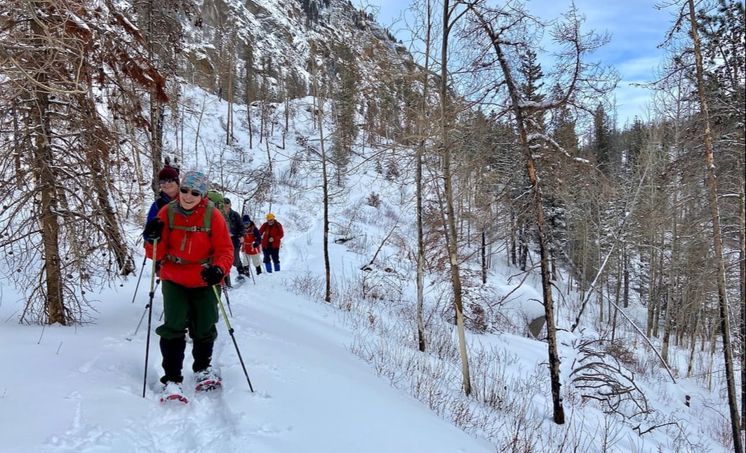 Image of snowshoers hiking to Fern Lake in Rocky Mountain National Park